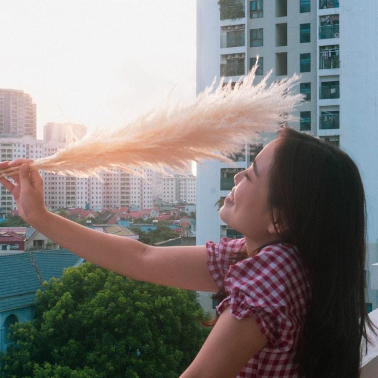 Aisha Rao, Lead Design Curator at Daily Progress Path, reviewing corporate floral arrangements